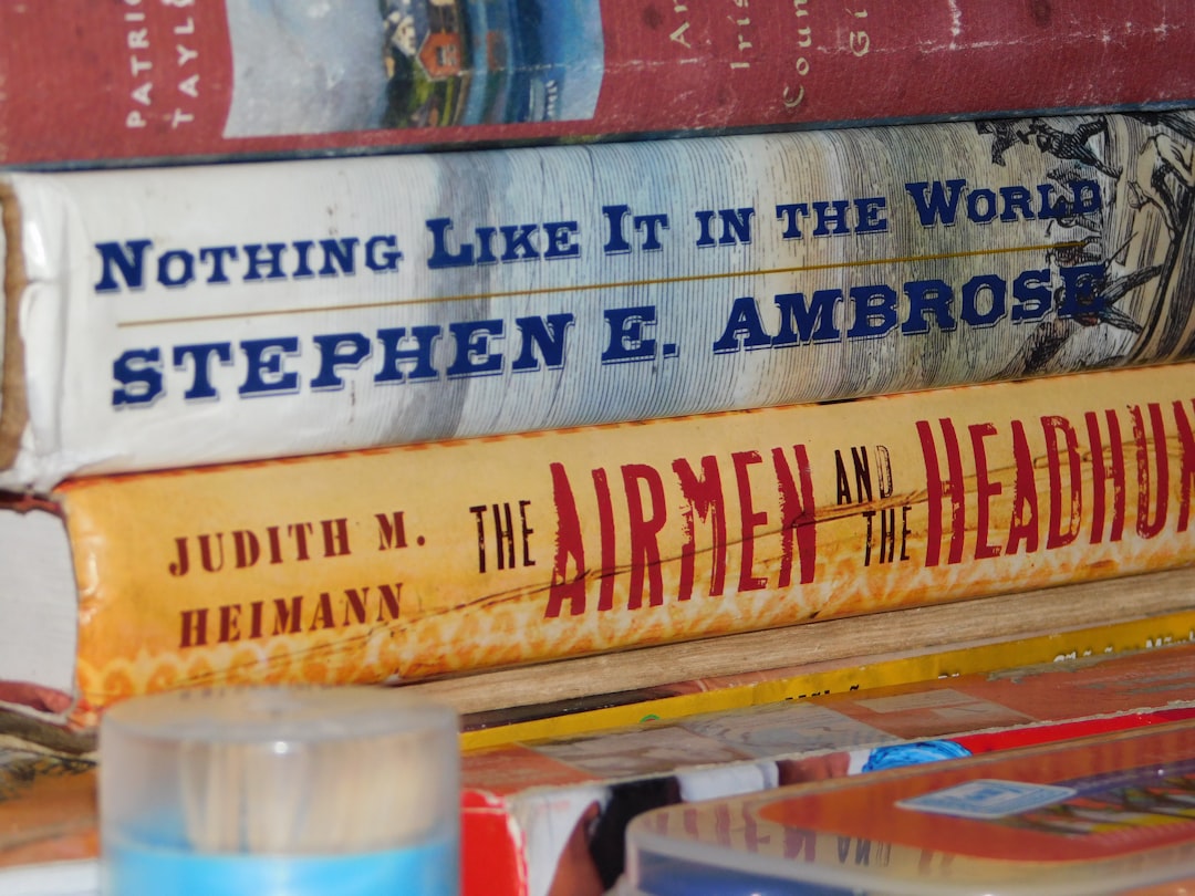 a-stack-of-books-sitting-on-top-of-a-table-rovcwnwl1s